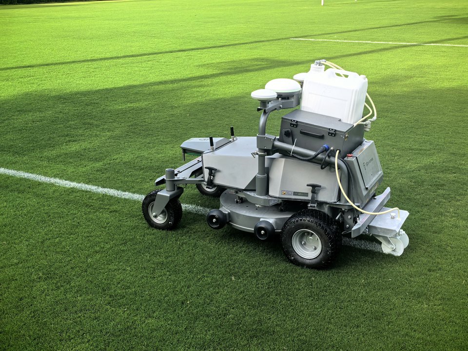 FJD RM21 with the LM01 Line Marker painting a line on a sports field